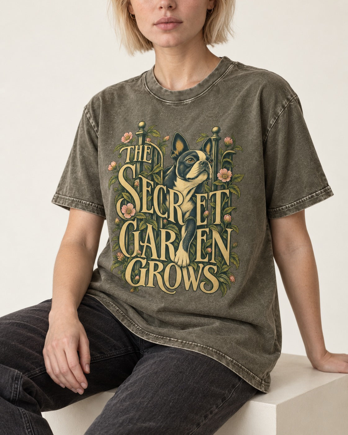 The Secret Garden Grows Boston Terrier Washed Tee in Army Green, worn by a seated model