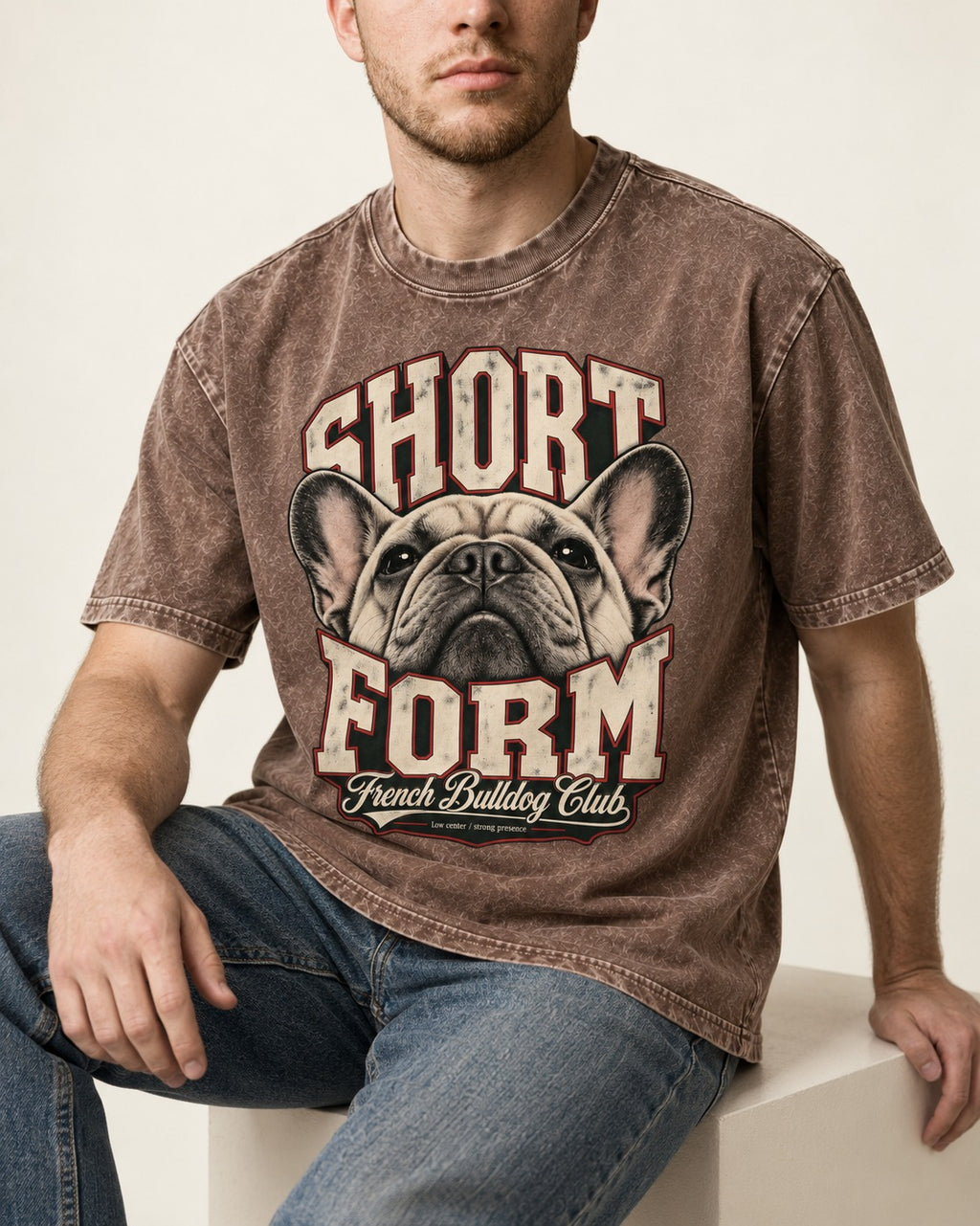 Short Form Frenchie Washed Tee in Coffee, worn by a seated model