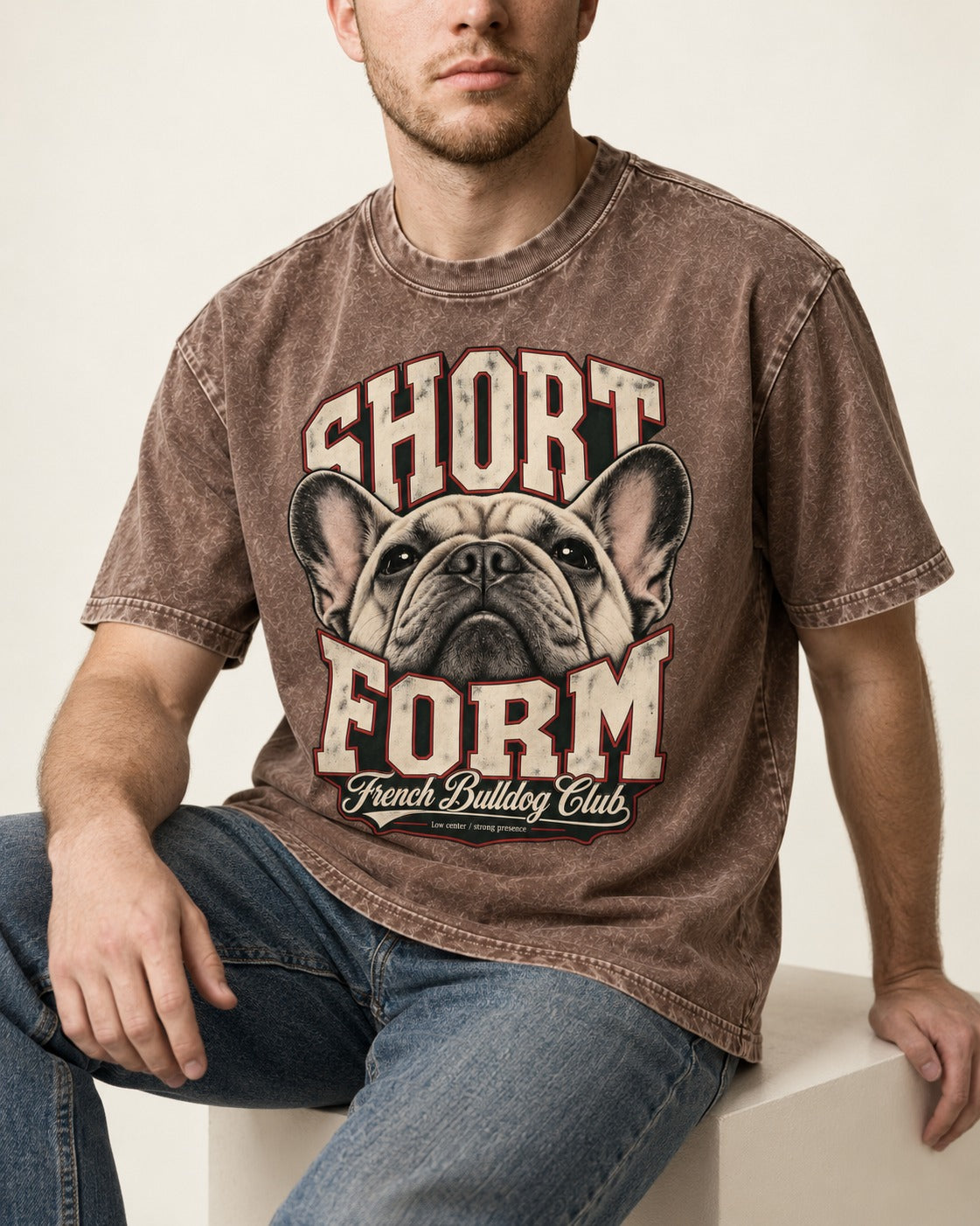Short Form Frenchie Washed Tee in Coffee, worn by a seated model