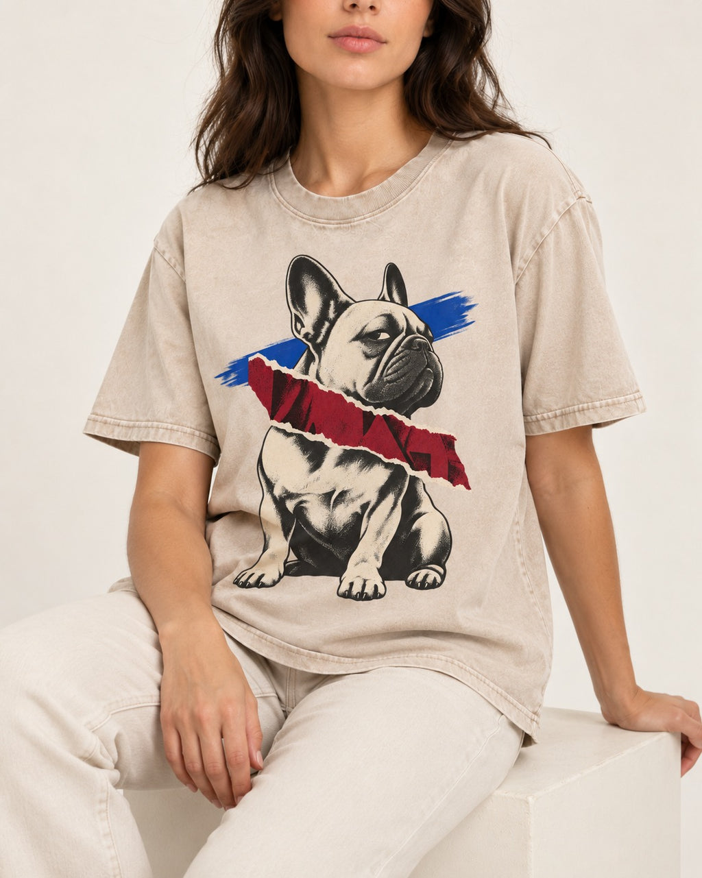 Frenchie Punk Washed Tee in Apricot, worn by a seated model