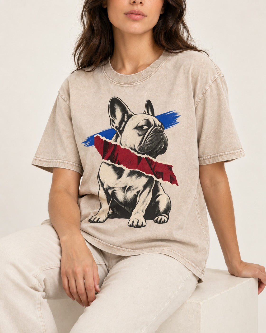 Frenchie Punk Washed Tee in Apricot, worn by a seated model