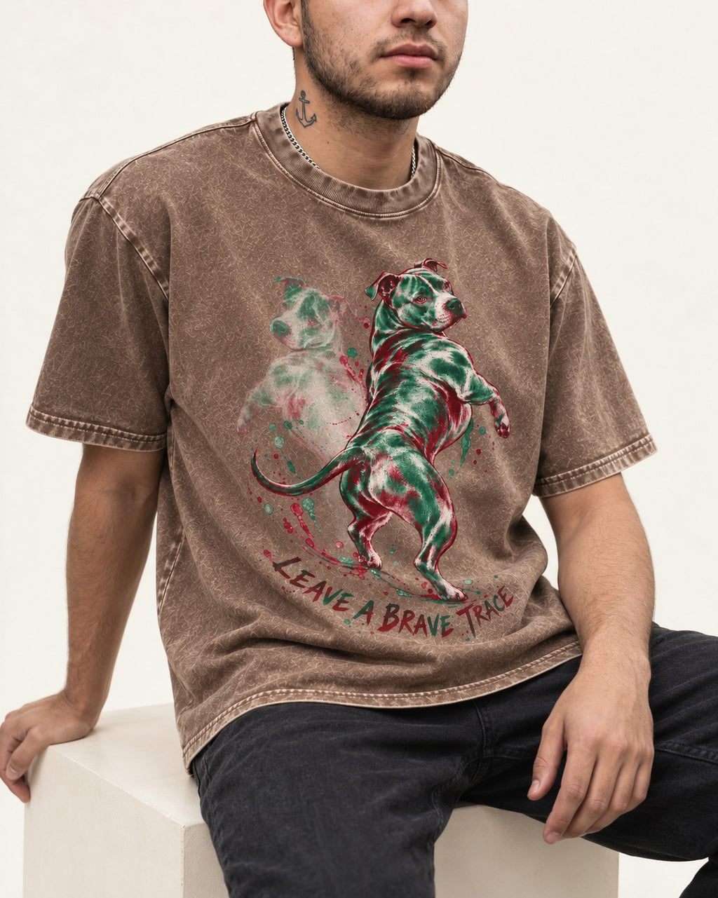 Pitbull's Brave Trace Washed Tee in Coffee, worn by a seated model
