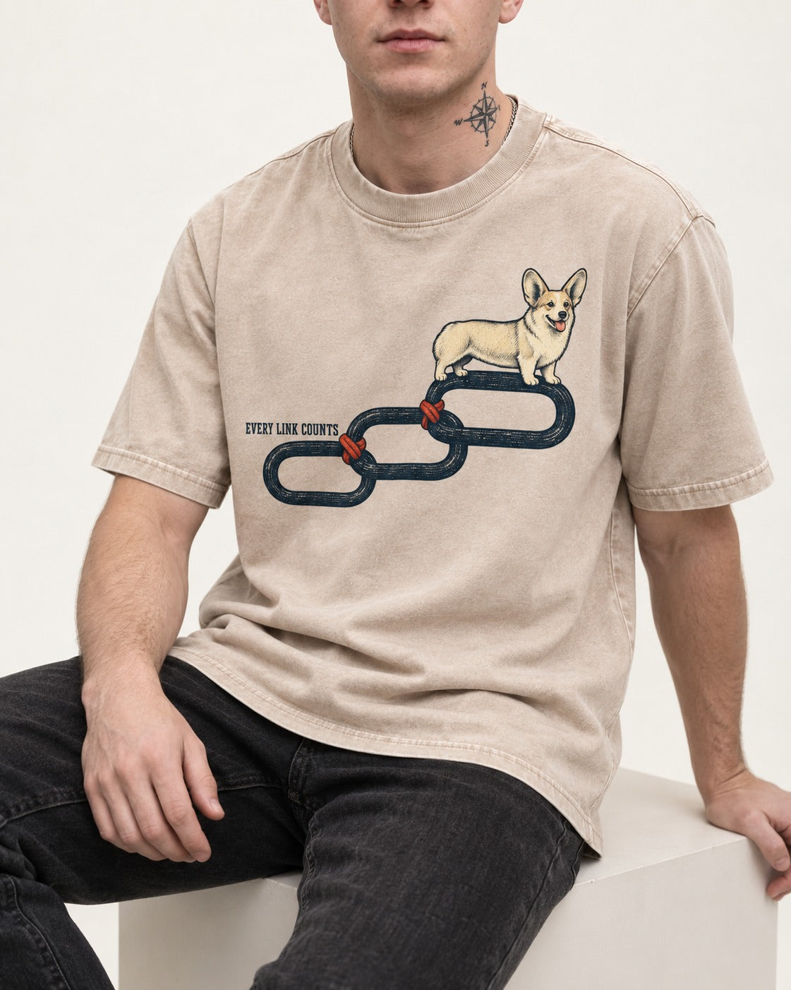 Every Corgi Link Counts Washed Tee in Apricot, worn by a seated model