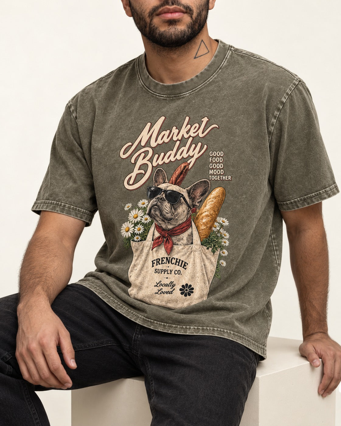 Frenchie Market Buddy Grocery Tote Graphic Washed Tee in Army Green, worn by a seated model
