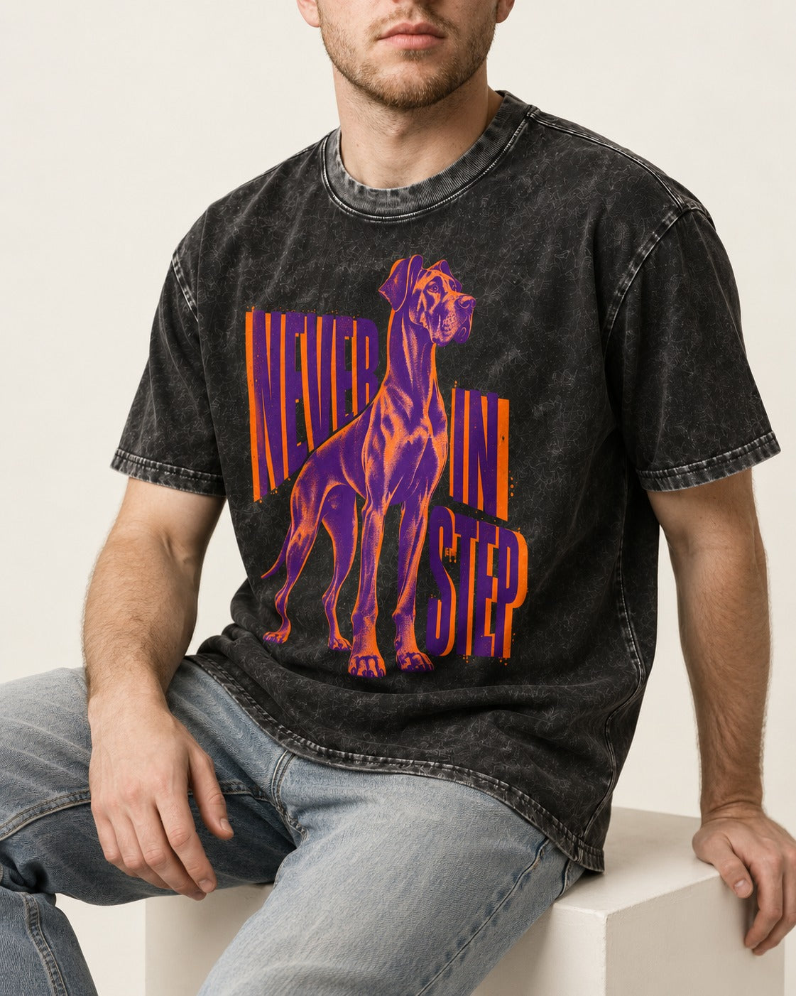 Great Dane Never in Step Standing Graphic Washed Tee in Black, worn by a seated model