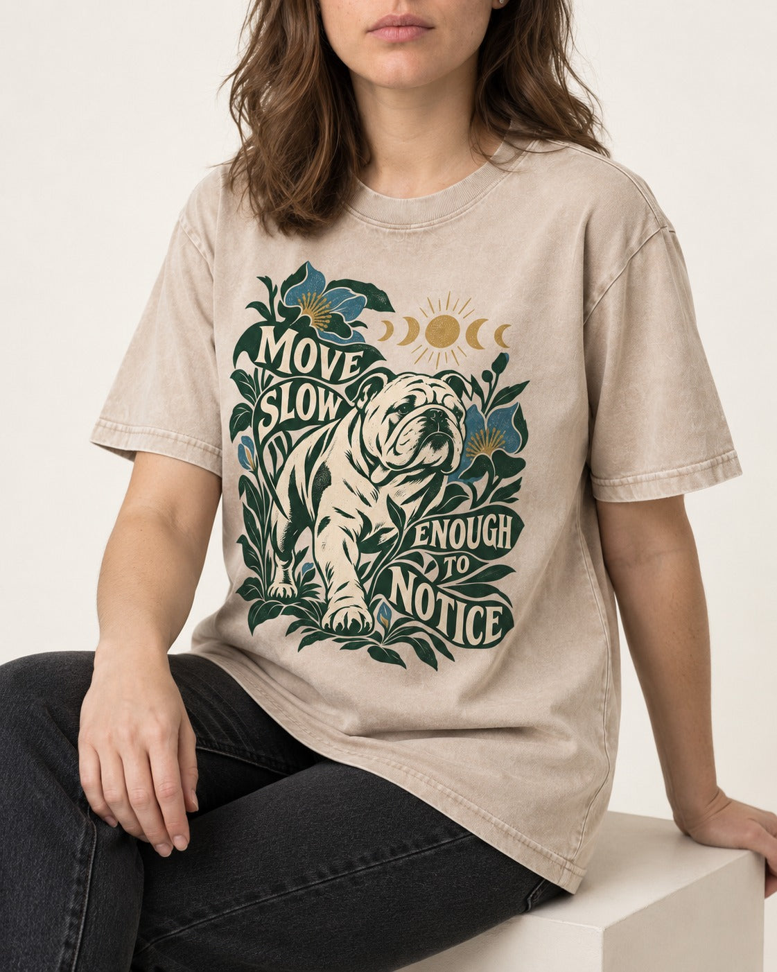 Move Slow English Bulldog Washed Tee in Apricot, worn by a seated model