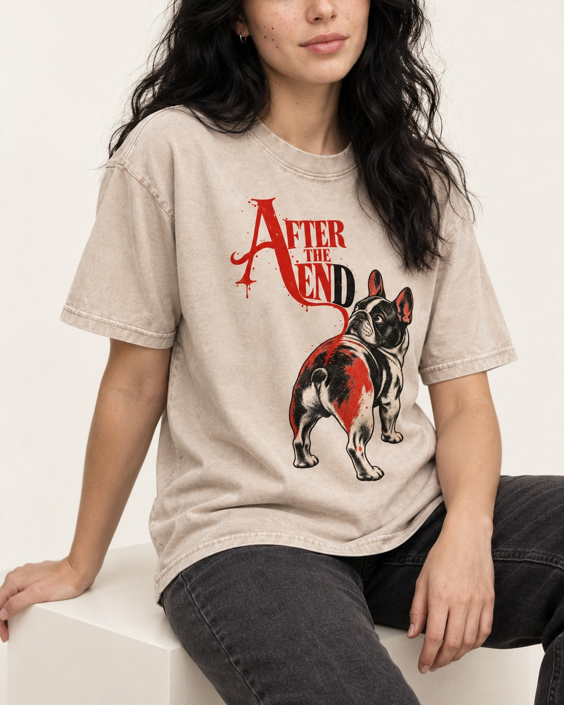 Frenchie After the End Washed Tee in Apricot, worn by a seated model