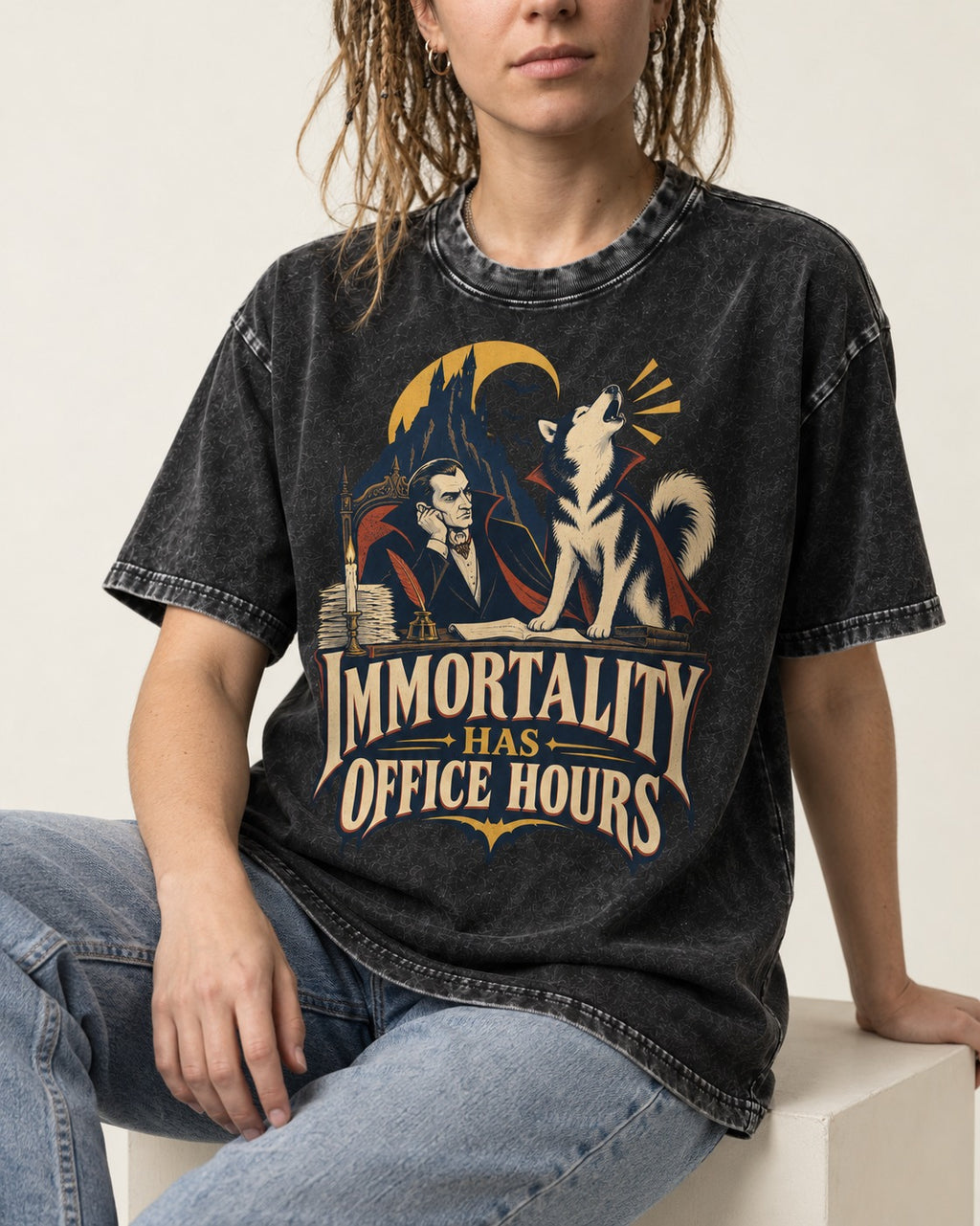 Husky Immortality Has Office Hours Vampire Office Graphic Washed Tee in Black, worn by a seated model