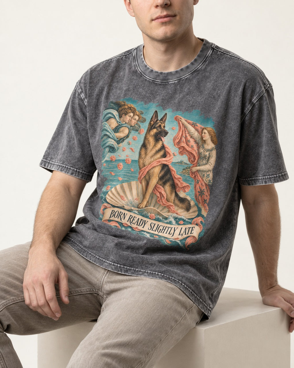 German Shepherd Dog Born Ready Slightly Late Venus Graphic Washed Tee in Gray, worn by a seated model