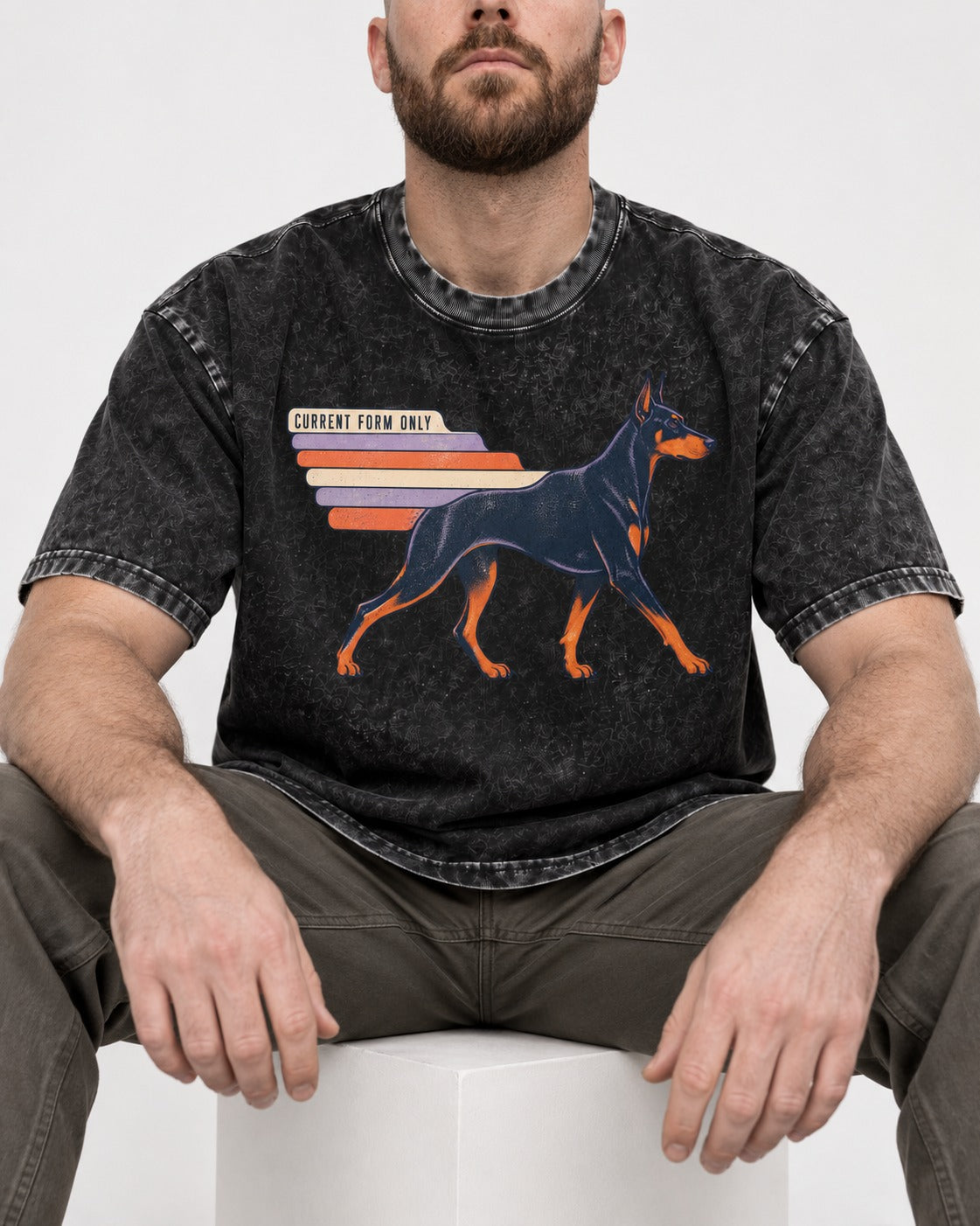 Doberman Current Form Only Speed Bars Graphic Washed Tee in Black, worn by a seated model