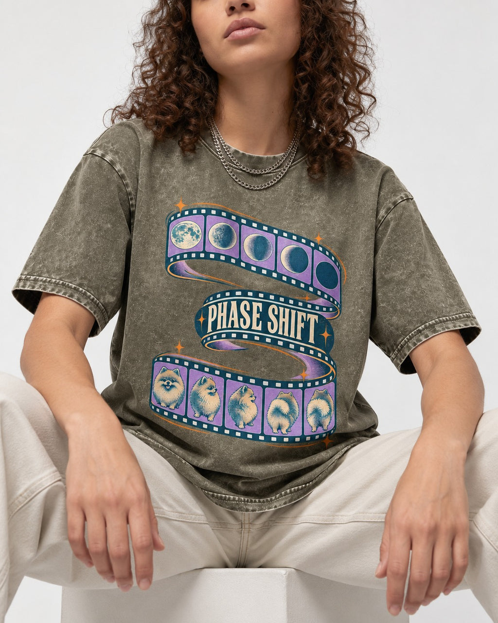 Pomeranian Phase Shift Filmstrip Graphic Washed Tee in Army Green, worn by a seated model