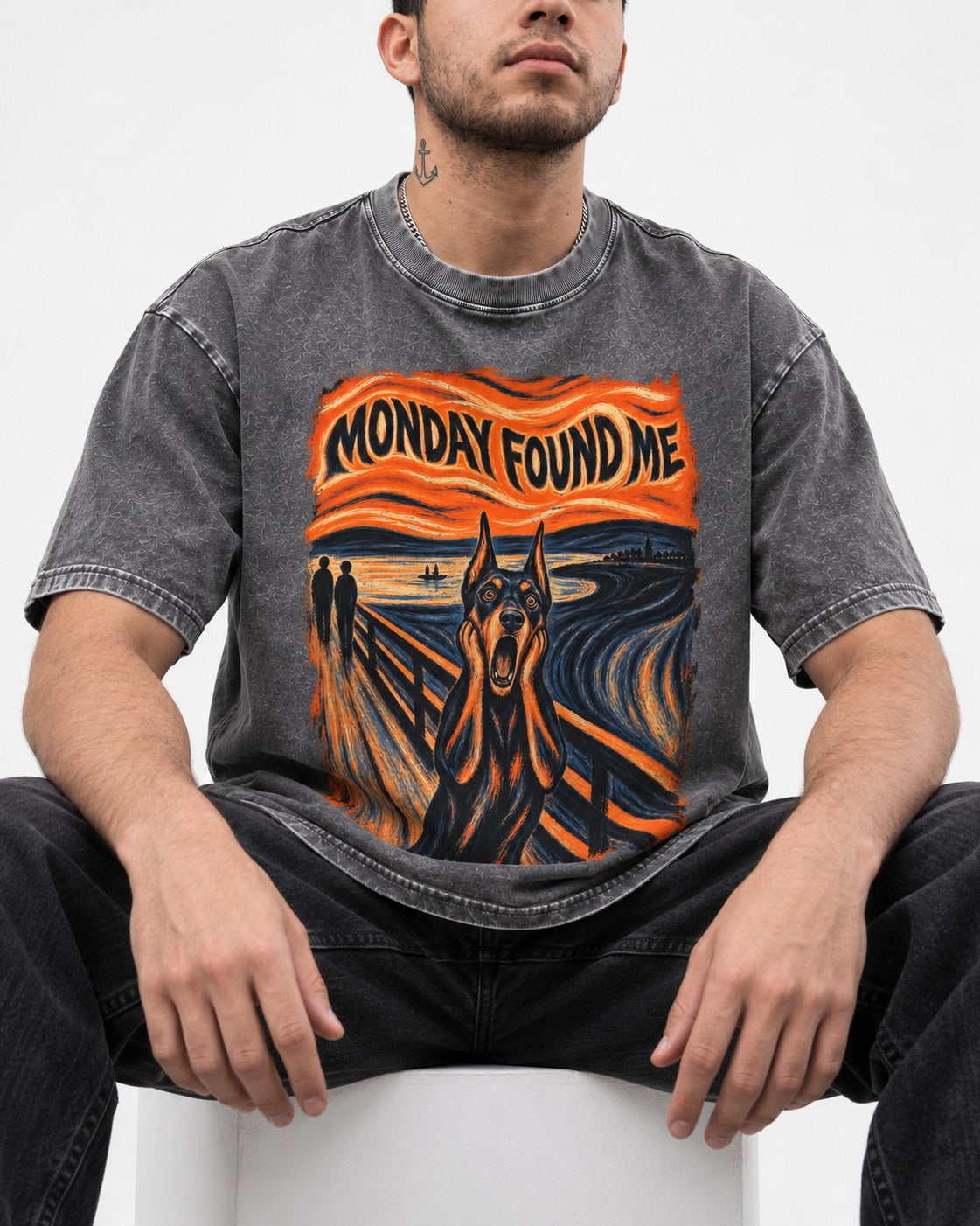 Doberman Monday Found Me Scream Graphic Washed Tee in Gray, worn by a seated model