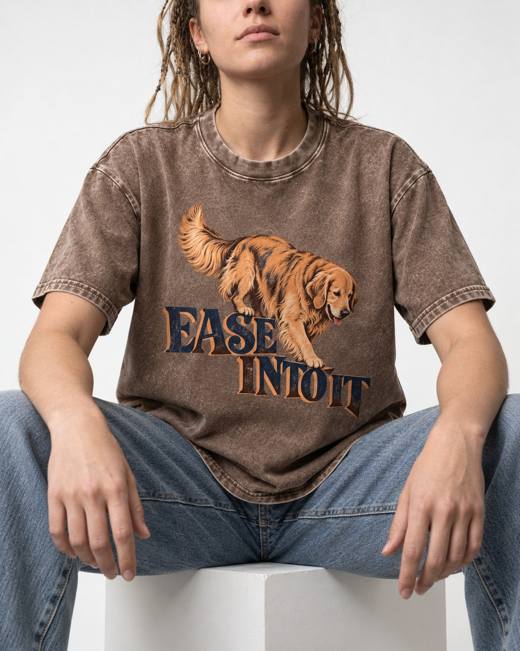 Golden Retriever Ease Into It Washed Tee in Coffee, worn by a seated model