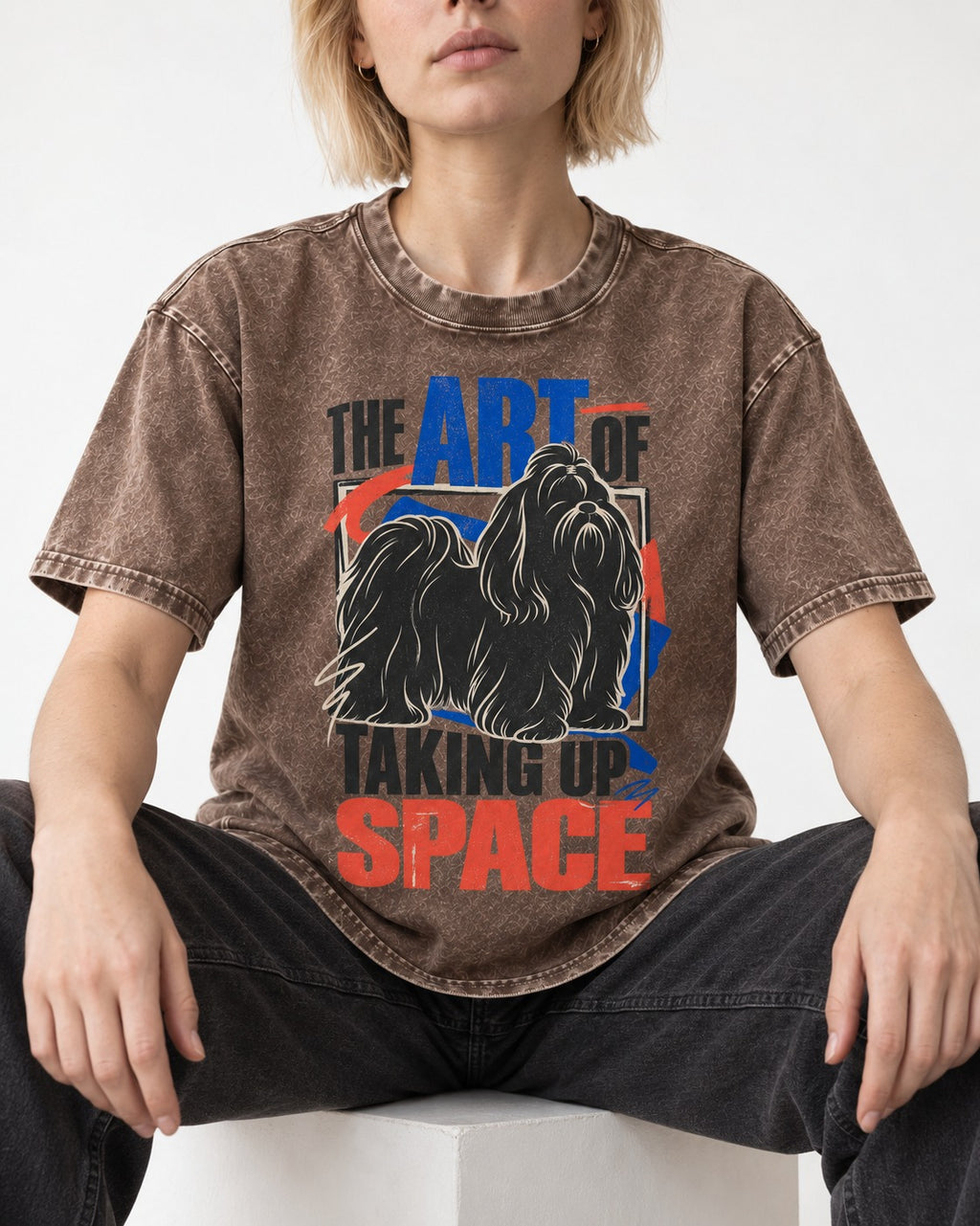 Shih Tzu Taking Up Space Washed Tee in Coffee, worn by a seated model