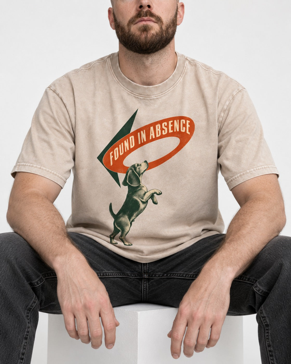 Beagle Found in Absence Washed Tee in Apricot, worn by a seated model