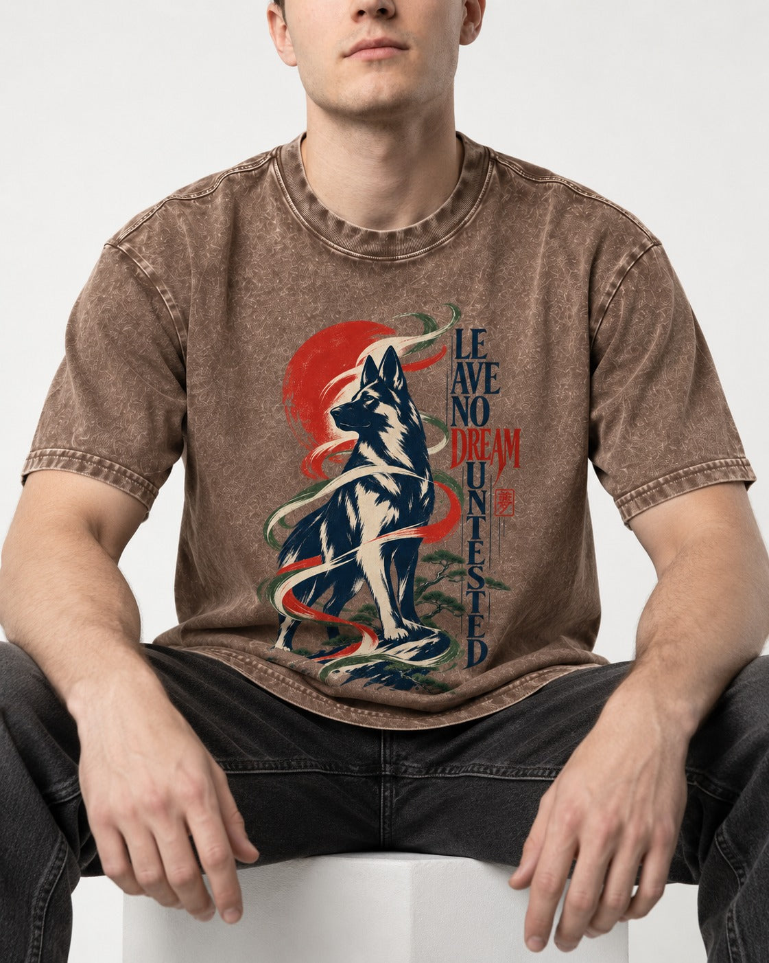 Leave No Dream Untested German Shepherd Dog Washed Tee in Coffee, worn by a seated model