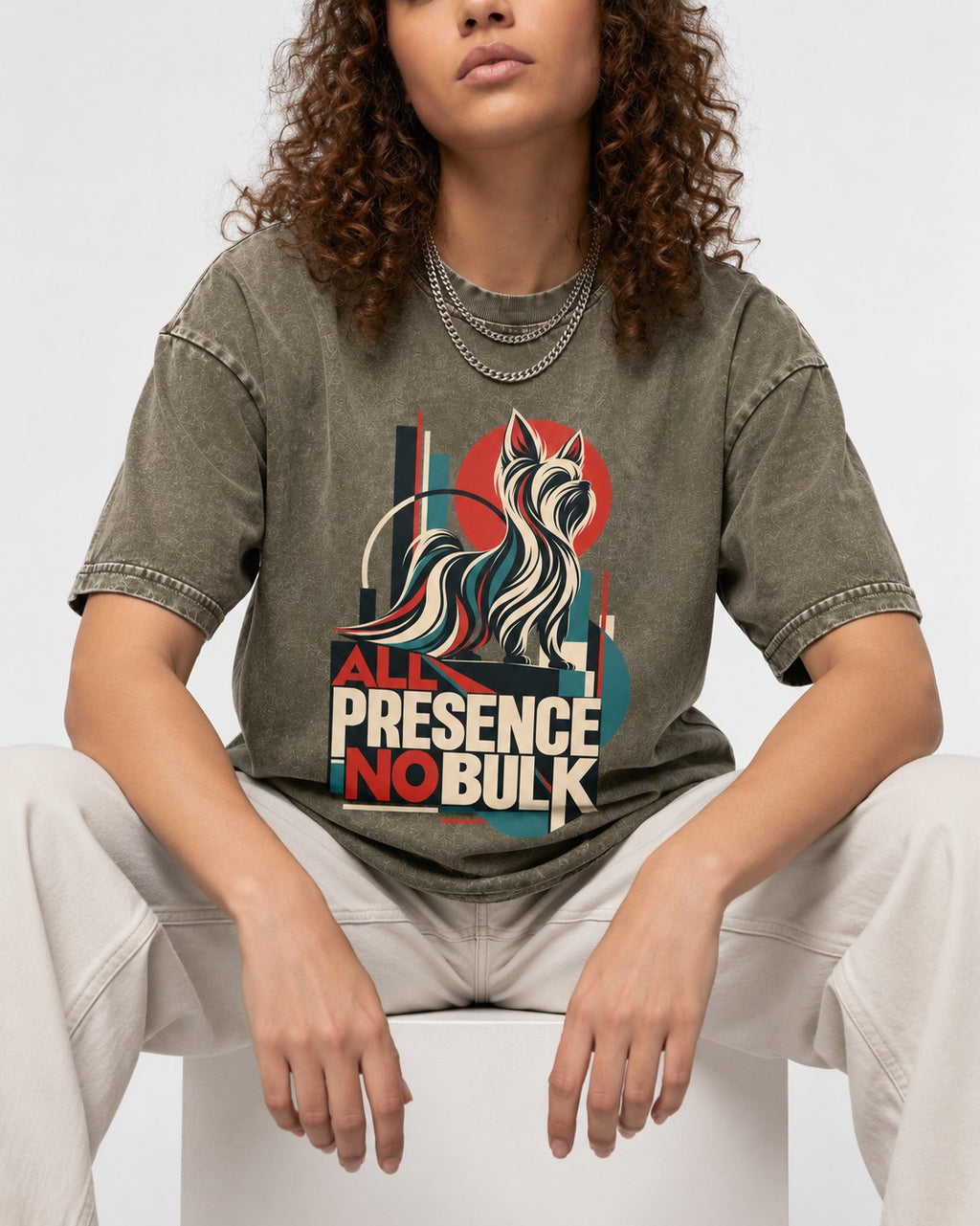 Yorkshire Terrier All Presence No Bulk Geometric Portrait Graphic Washed Tee in Army Green, worn by a seated model