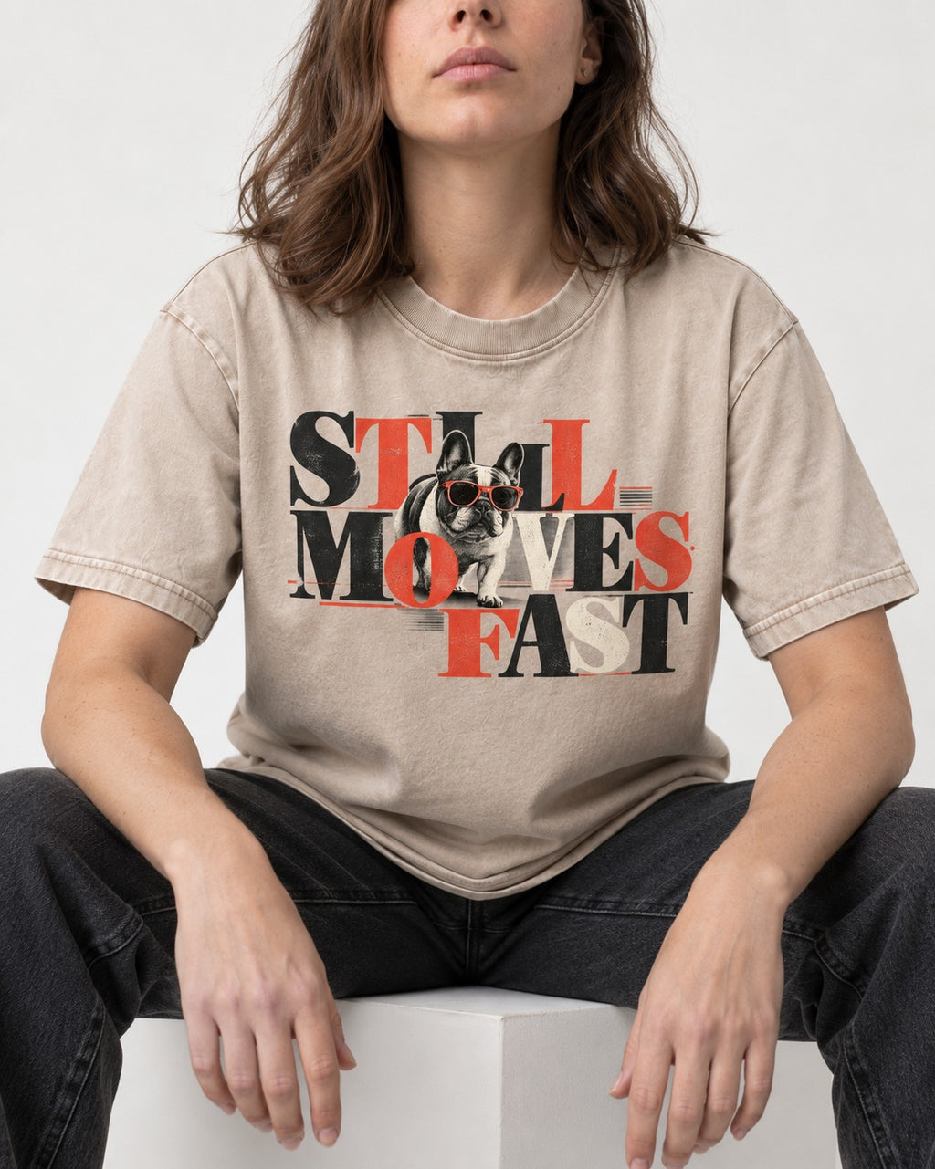 Frenchie Still Moves Fast Washed Tee in Apricot, worn by a seated model