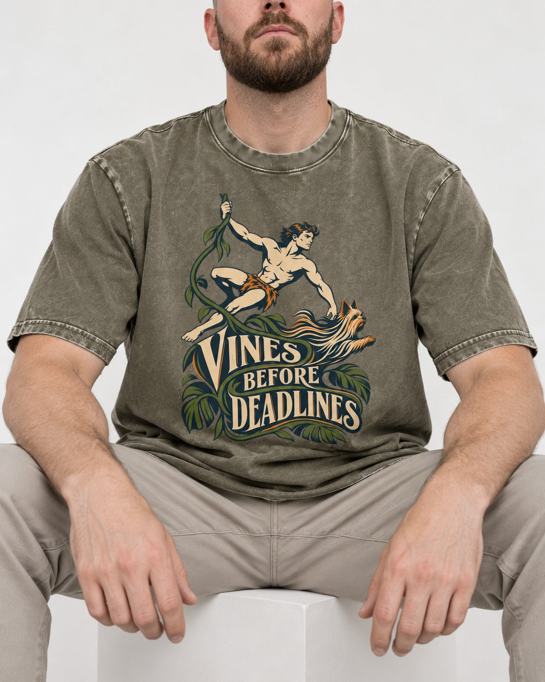 Yorkshire Terrier Vines Before Deadlines Jungle Hero Graphic Washed Tee in Army Green, worn by a seated model