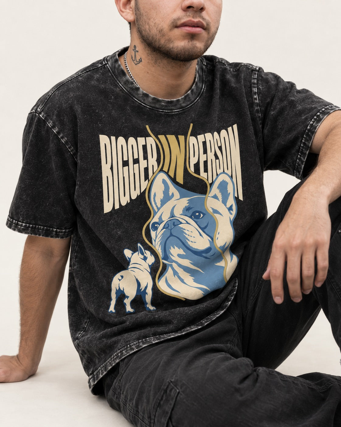 Frenchie Bigger in Person Mirror Graphic Washed Tee in Black, worn by a seated model