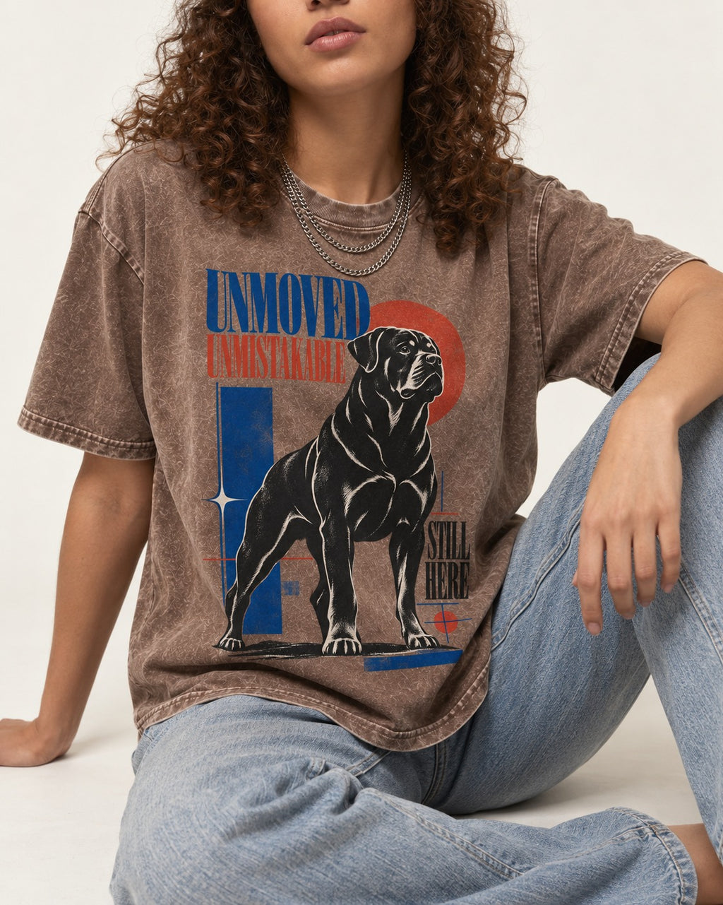 Unmoved Unmistakable Rottweiler Washed Tee in Coffee, worn by a seated model