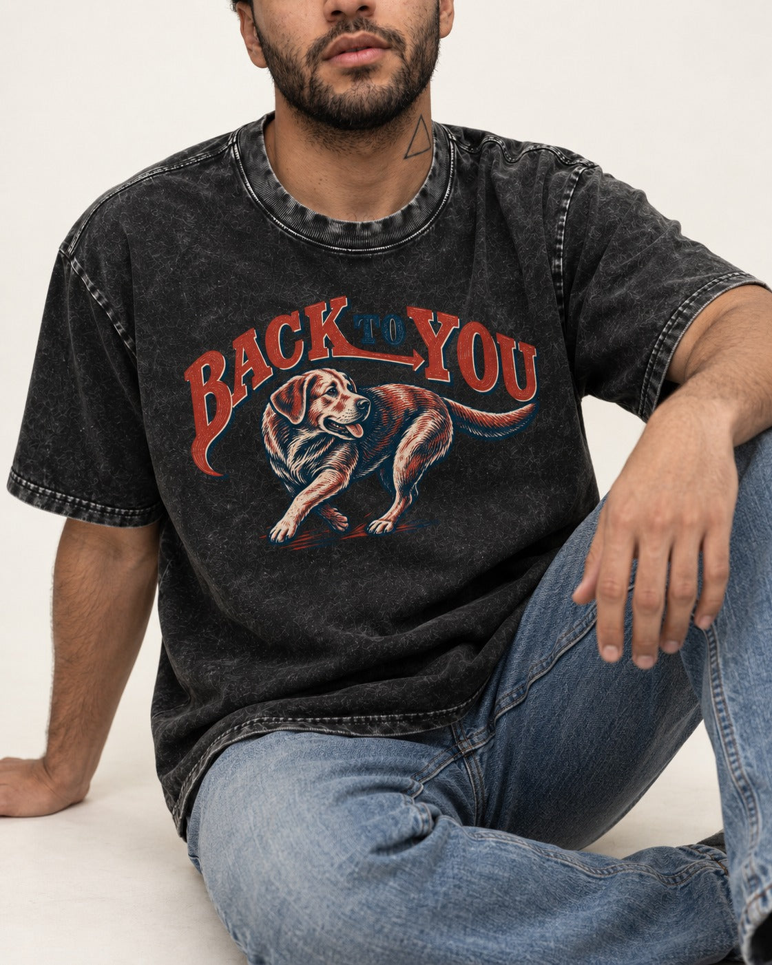 Labrador Retriever Back to You Turning Graphic Washed Tee in Black, worn by a seated model