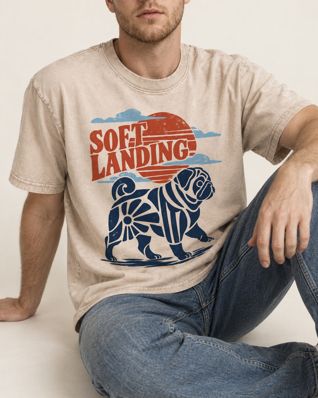 Pug's Soft Landing Washed Tee in Apricot, worn by a seated model