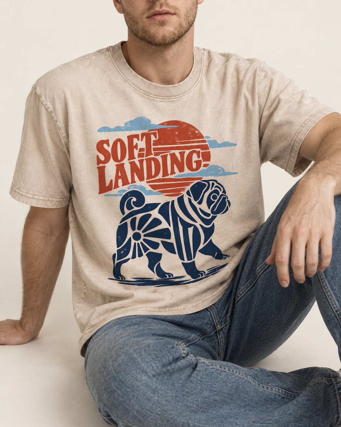 Pug's Soft Landing Washed Tee in Apricot, worn by a seated model
