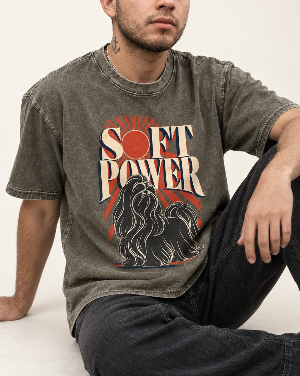 Shih Tzu Soft Power Sunburst Graphic Washed Tee in Army Green, worn by a seated model