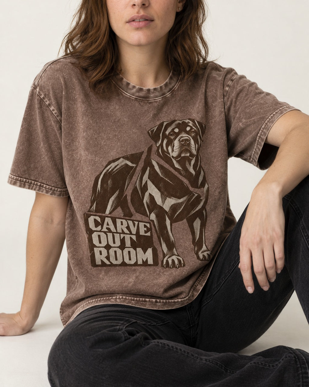 Carve Out Room for Rottweiler Washed Tee in Coffee, worn by a seated model