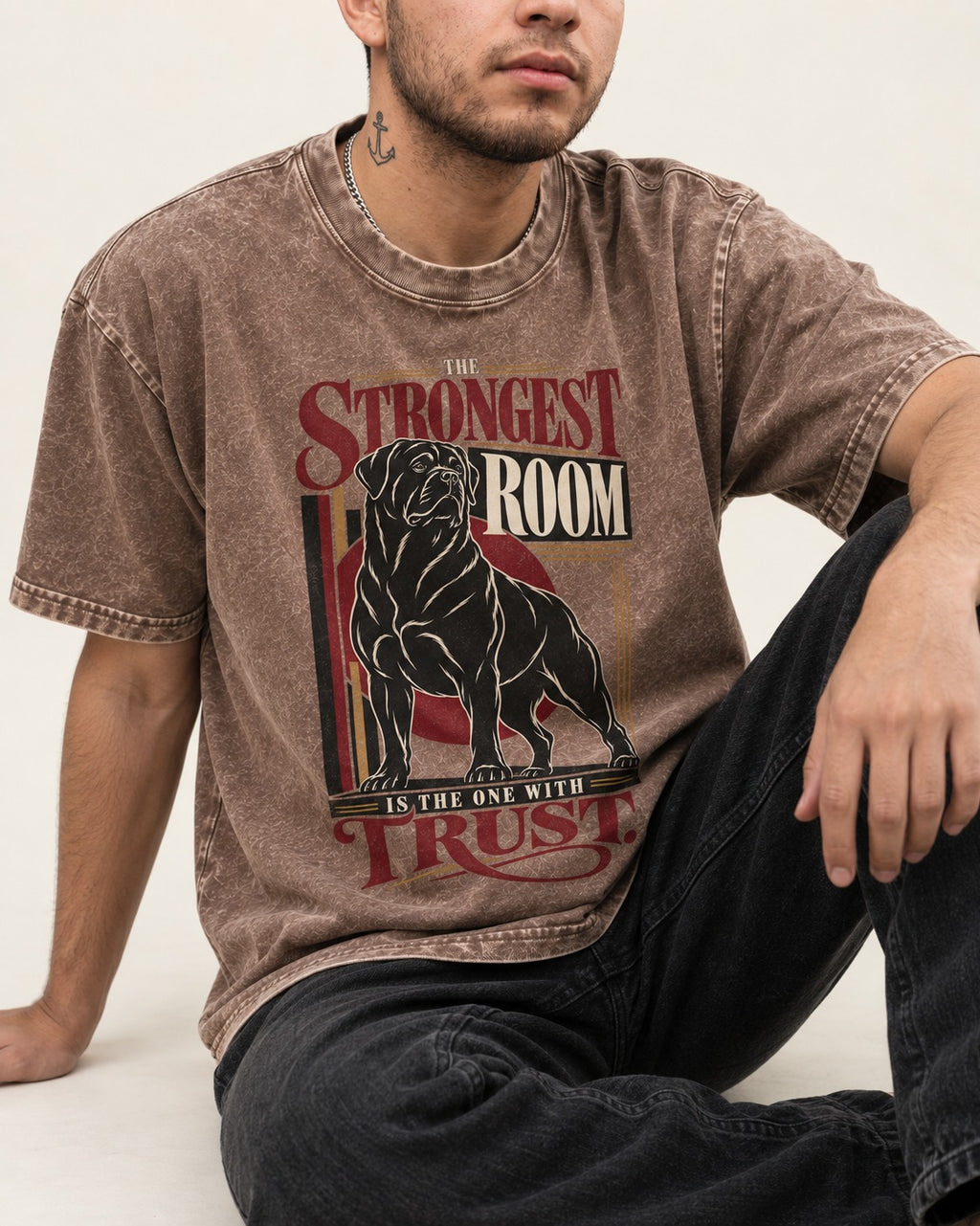Rottweiler Trust Washed Tee in Coffee, worn by a seated model