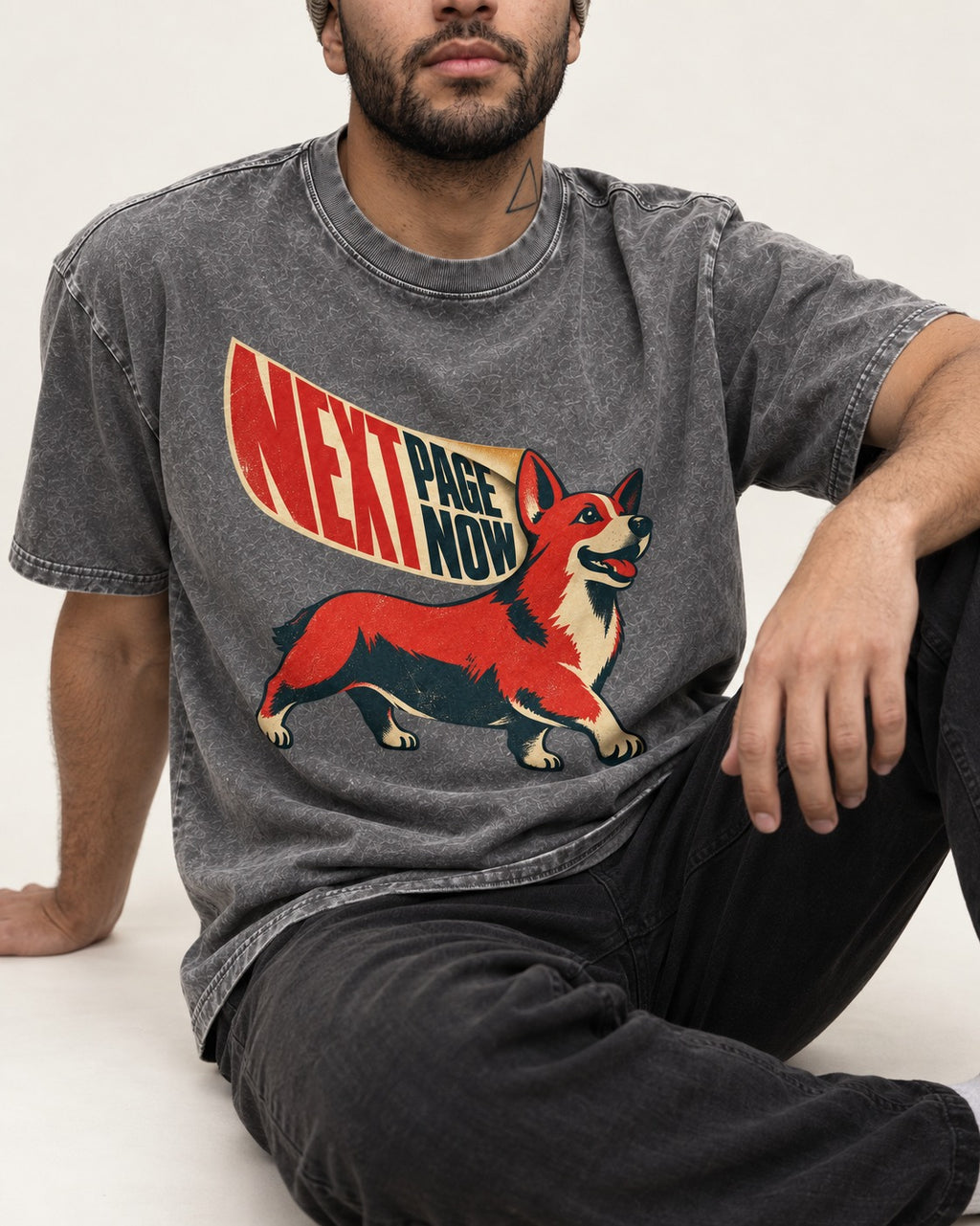Corgi Next Page Now Pennant Graphic Washed Tee in Gray, worn by a seated model