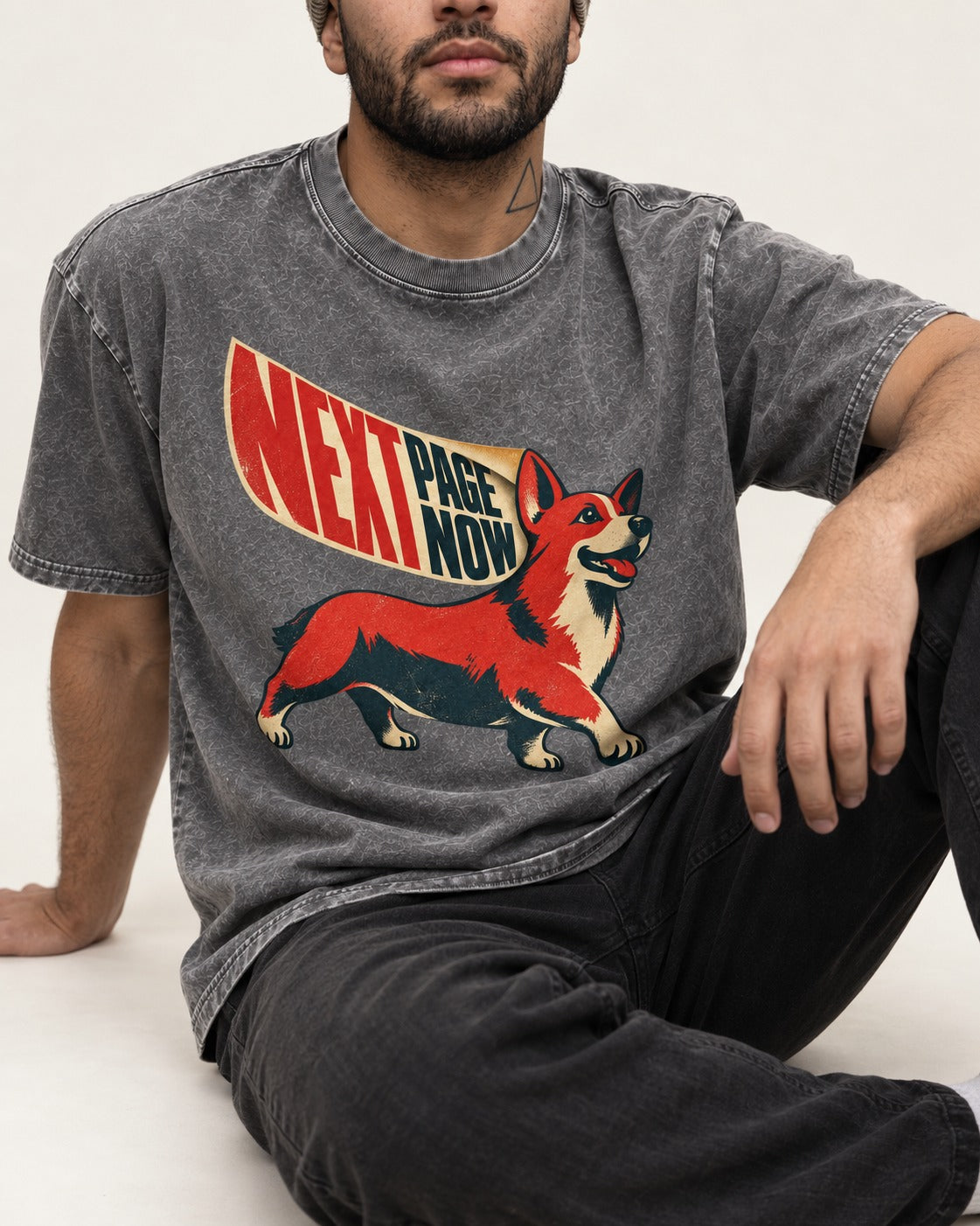 Corgi Next Page Now Pennant Graphic Washed Tee in Gray, worn by a seated model