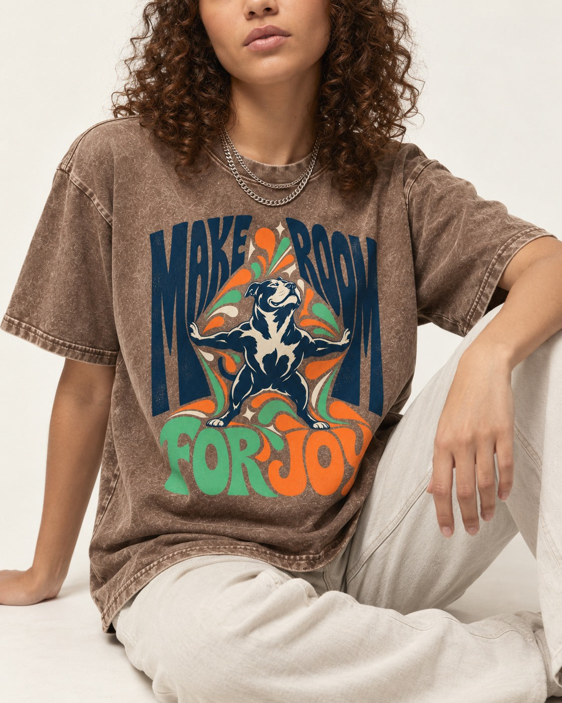 Pitbull Make Room for Joy Washed Tee in Coffee, worn by a seated model