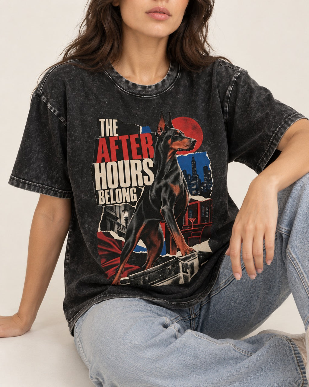 Doberman The After Hours Belong City Collage Washed Tee in Black, worn by a seated model