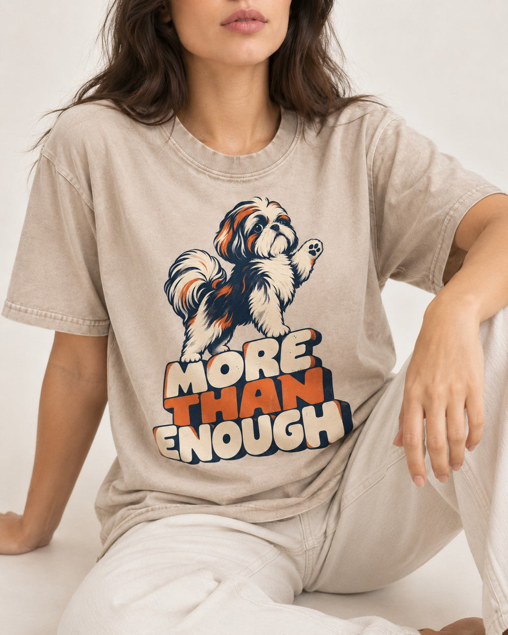 More Than Enough Shih Tzu Washed Tee in Apricot, worn by a seated model