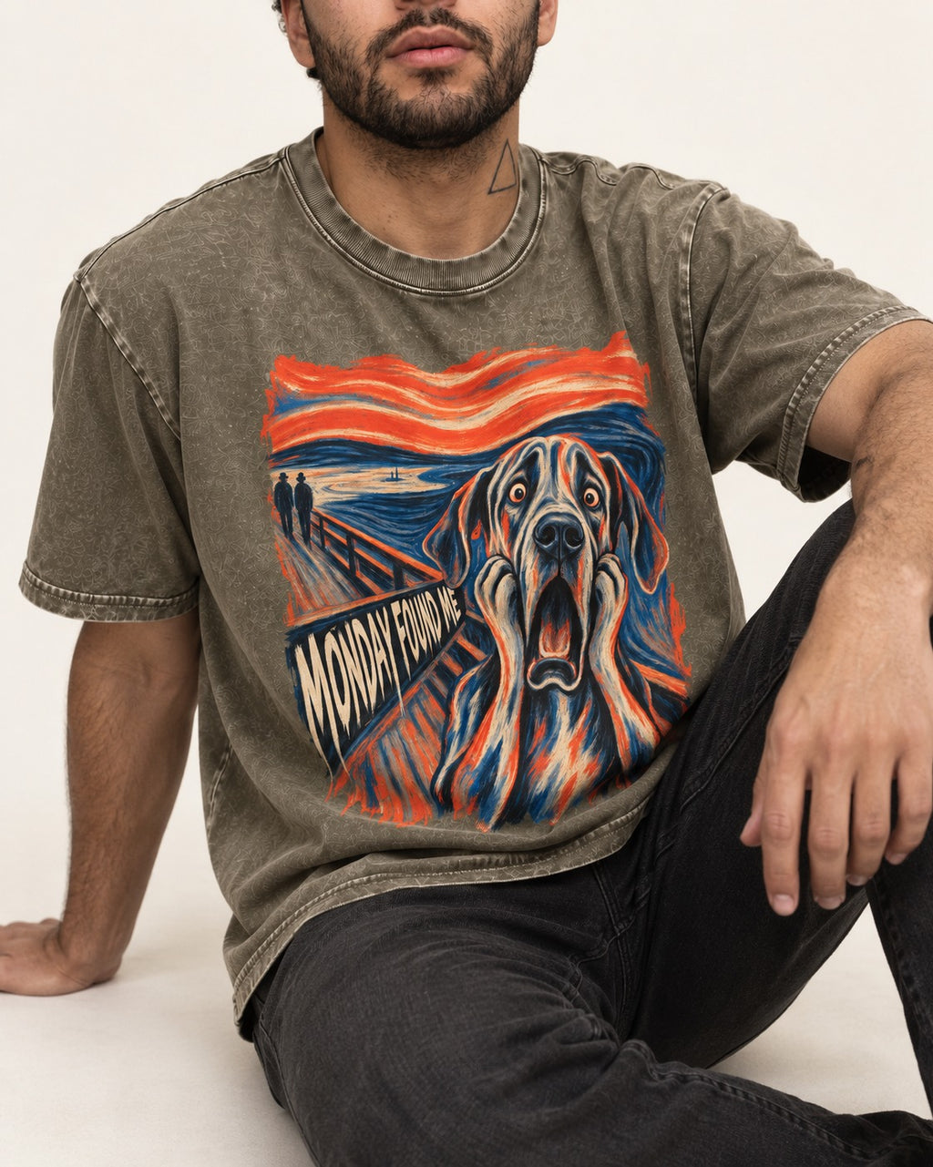 Great Dane Monday Found Me Scream Parody Graphic Washed Tee in Army Green, worn by a seated model