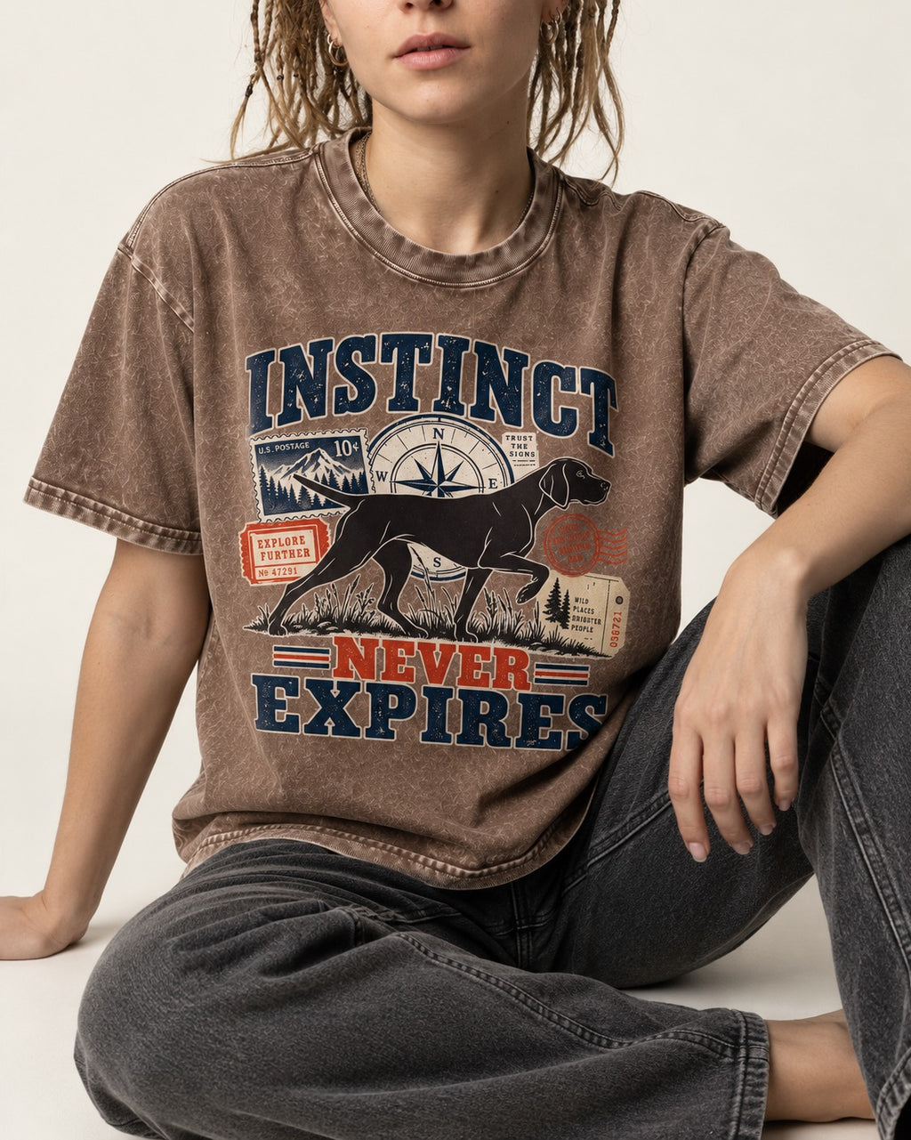 German Shorthaired Pointer Instinct Never Expires Washed Tee in Coffee, worn by a seated model
