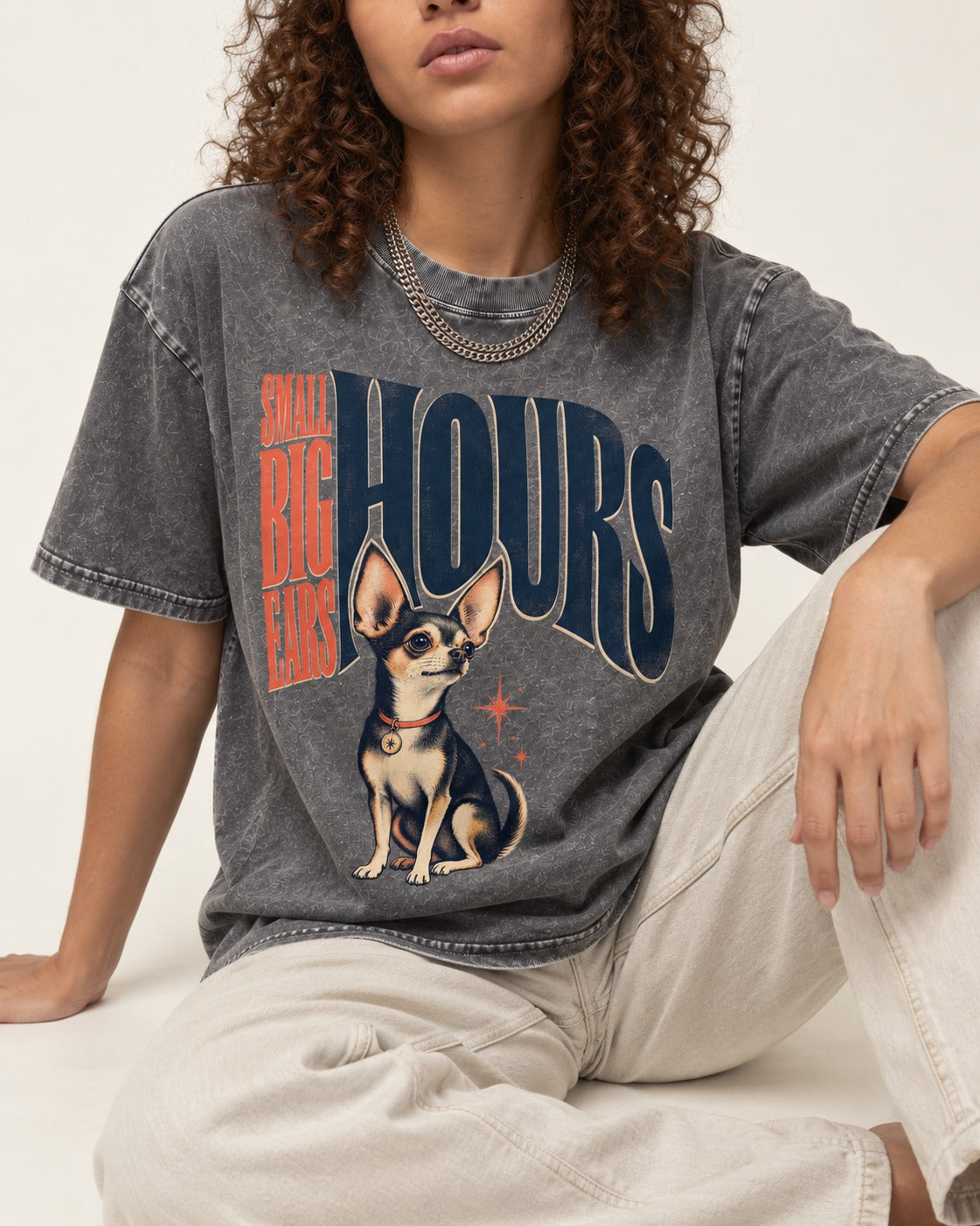 Chihuahua Small Big Ears Hours Washed Tee in Gray, worn by a seated model