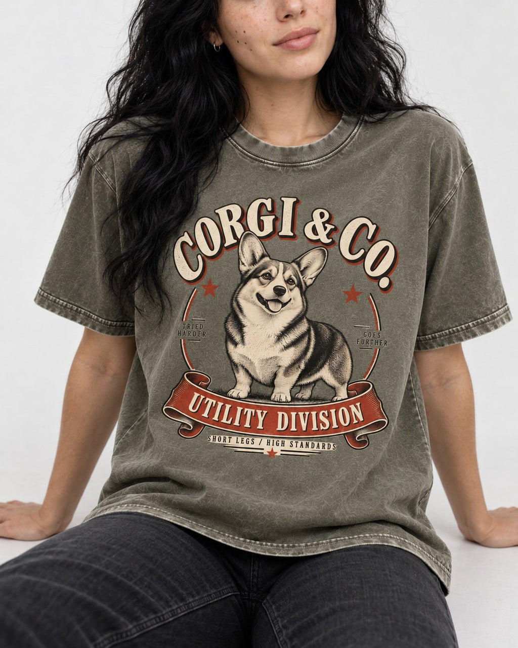 Corgi and Co Utility Division Emblem Washed Tee in Army Green, worn by a seated model