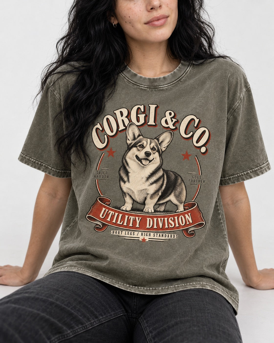 Corgi and Co Utility Division Emblem Washed Tee in Army Green, worn by a seated model