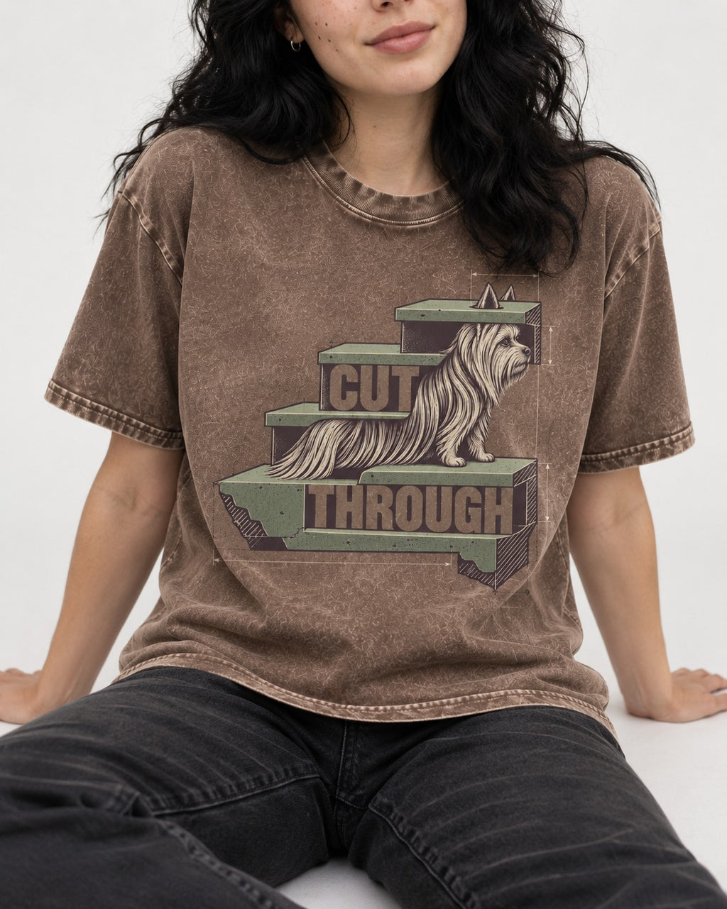 Yorkshire Terrier Cut Through Washed Tee in Coffee, worn by a seated model