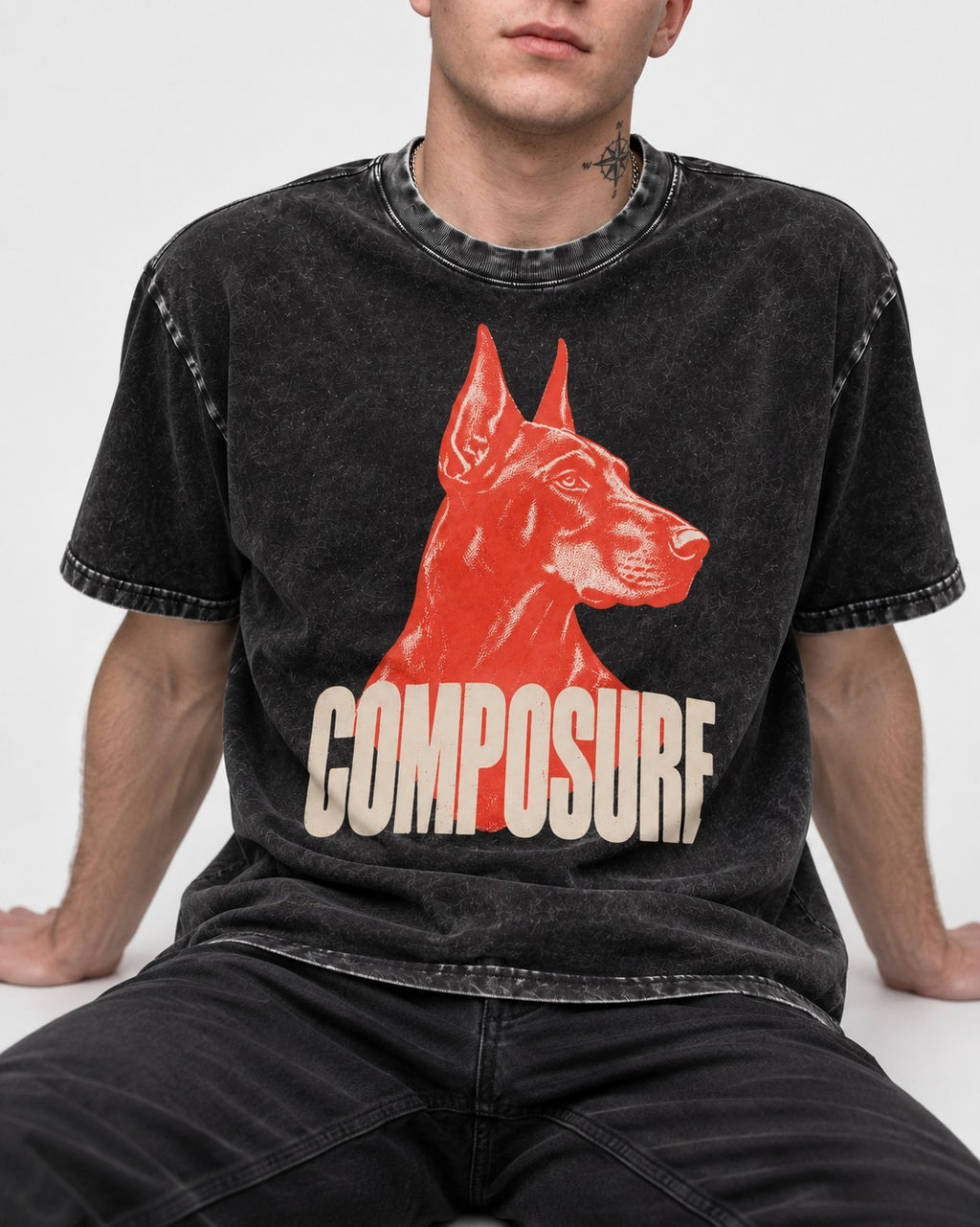 Doberman Composure Portrait Graphic Washed Tee in Black, worn by a seated model