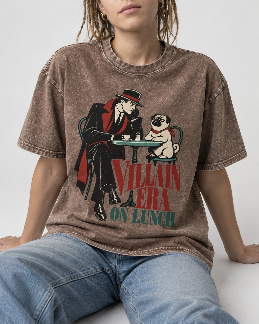 Pug Villain Era Washed Tee in Coffee, worn by a seated model