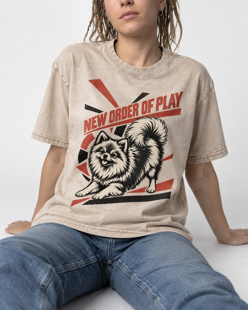 Pomeranian Order of Play Washed Tee in Apricot, worn by a seated model
