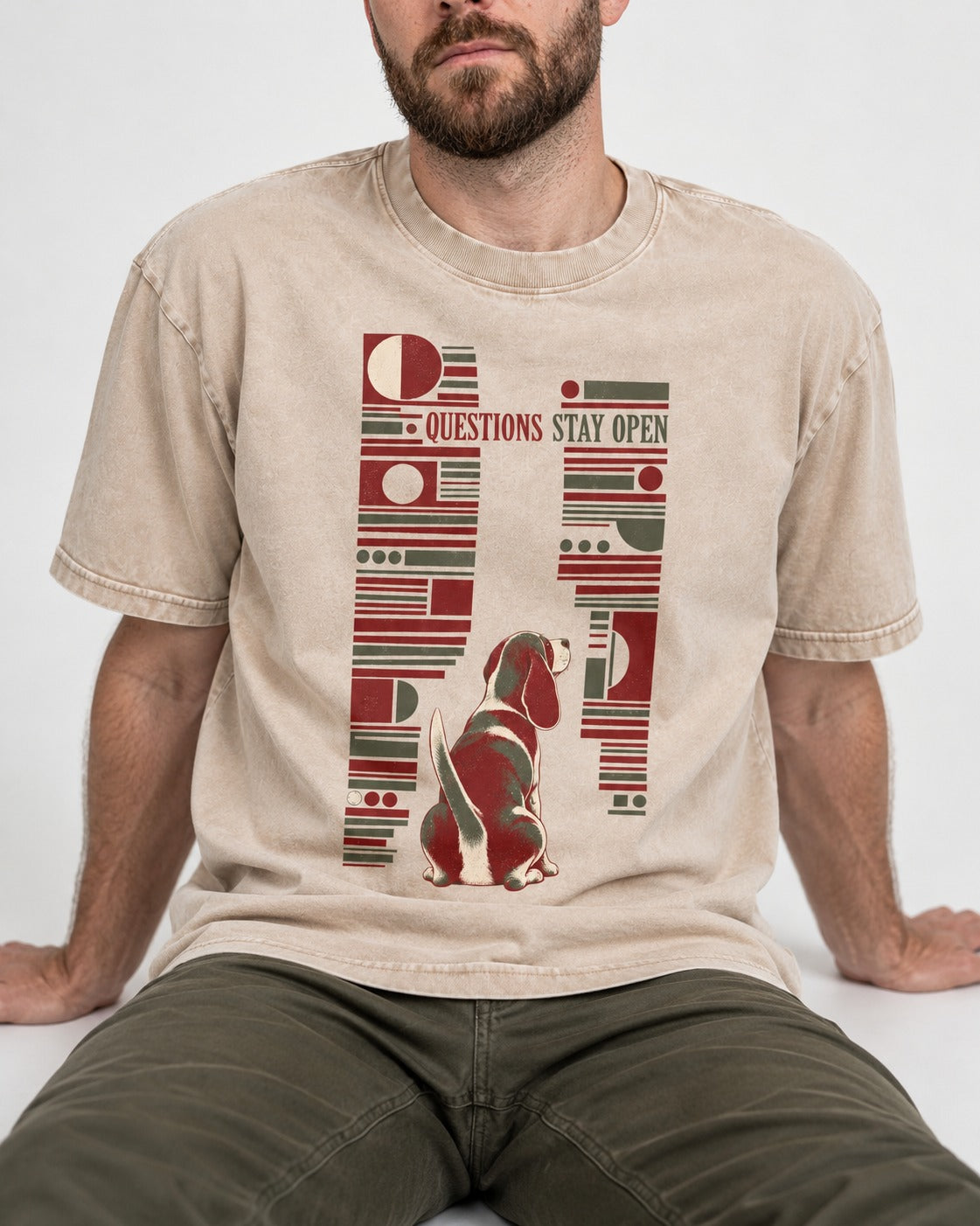 Beagle Questions Stay Open Washed Tee in Apricot, worn by a seated model