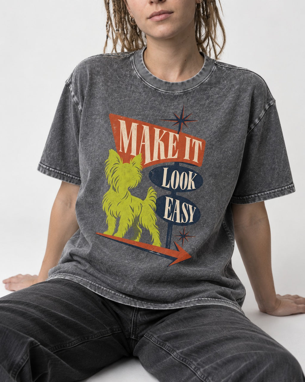 Yorkshire Terrier Make It Look Easy Retro Sign Graphic Washed Tee in Gray, worn by a seated model