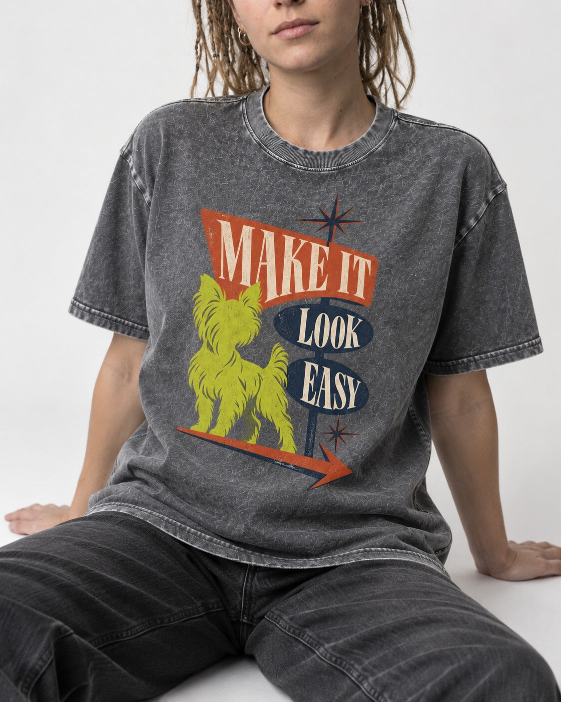 Yorkshire Terrier Make It Look Easy Retro Sign Graphic Washed Tee in Gray, worn by a seated model