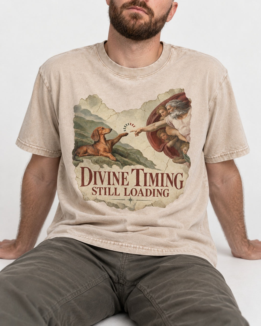 Dachshund's Divine Timing Washed Tee in Apricot, worn by a seated model