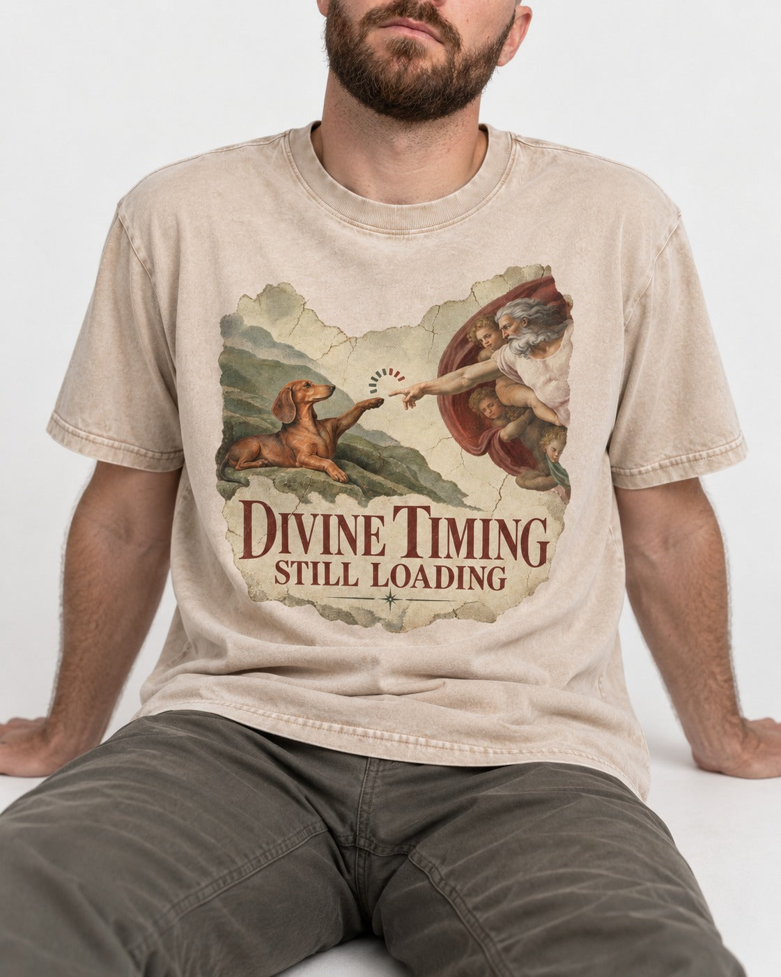 Dachshund's Divine Timing Washed Tee in Apricot, worn by a seated model